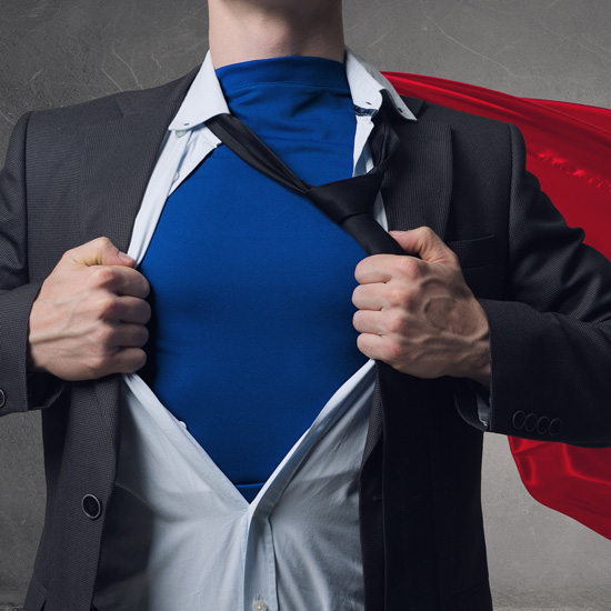 How To Be a Hero to Your Compliance Team; Man in business suit opens shirt to reveal a blue superhero outfit underneath, with a red cape flowing behind, conveying empowerment and transformation.