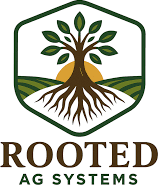 A logo of a tree with it's roots in the ground and a sun behind it and the black words below it "Rooted Ag Systems"